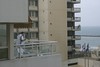 Jonathan Siegel (JSBird) > Looking out to the hotel next door, a man on the balcony greeted the early morning with prayer