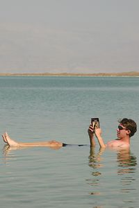 Jonathan Siegel (JSBird) > Max reads some of his homework. All of your body floats completely- your feet also; even in water "over your head", you float upright. It is almost like being weightless. Very wierd...