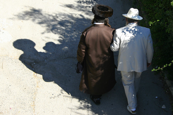 Jonathan Siegel (JSBird) > Sabbath (Shabbat) morning. Two friends chat on way to synagogue. Many sects of Judaism are represented in this city, the dress of the man on the left shows he belongs to a sect that hails from eastern Europe