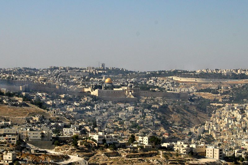 Jonathan Siegel (JSBird) > A view of Jerusalem to the north, with the Dome of the Rock in the center. The old city walls are seen, and the surrounding "new" city dwarfs the old. Arab neighborhoods are in the foreground and the right; the other neighborhoods are mainly Jewish