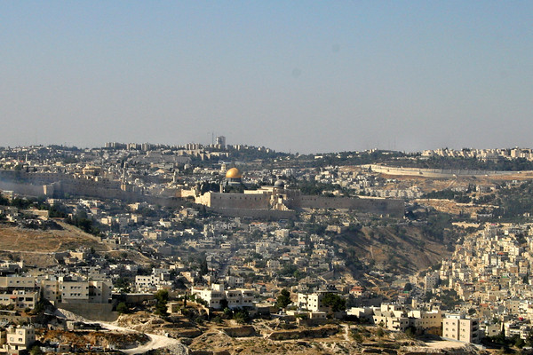 Jonathan Siegel (JSBird) > A view of Jerusalem to the north, with the Dome of the Rock in the center. The old city walls are seen, and the surrounding "new" city dwarfs the old. Arab neighborhoods are in the foreground and the right; the other neighborhoods are mainly Jewish